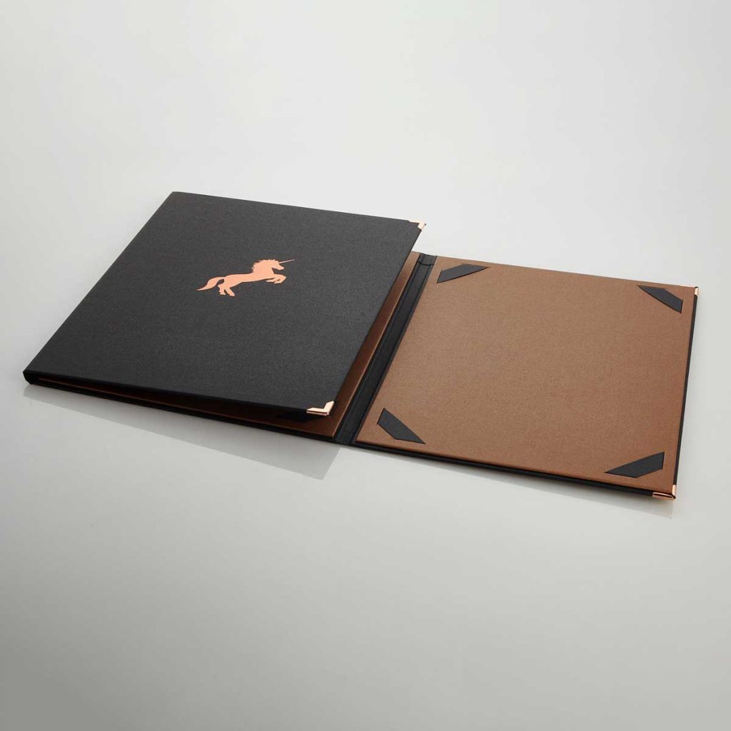 Two coloured information folder covered in Metallium